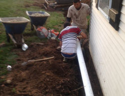 Underground PVC Pipes Connected to Downspouts